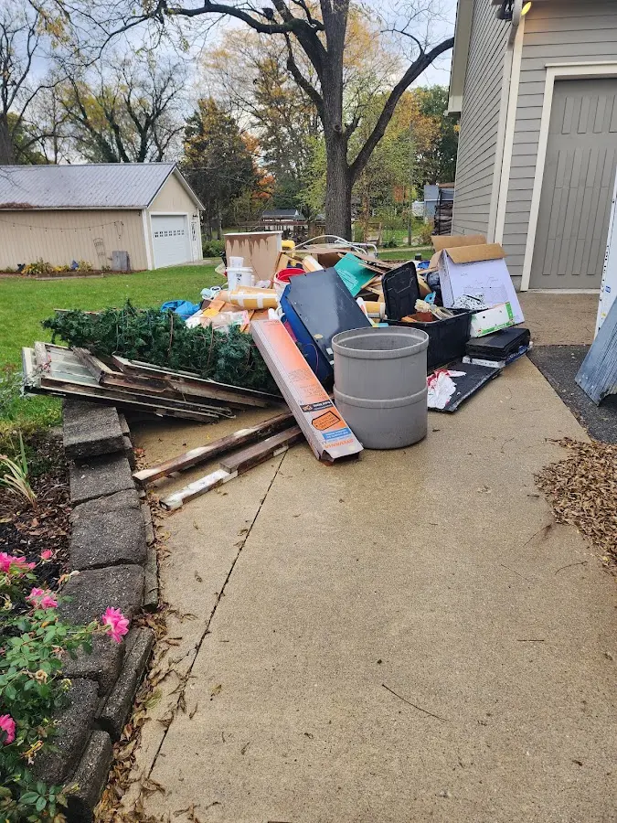 Dumpster being loaded with debris for Roofing Dumpster Rental in North Coventry